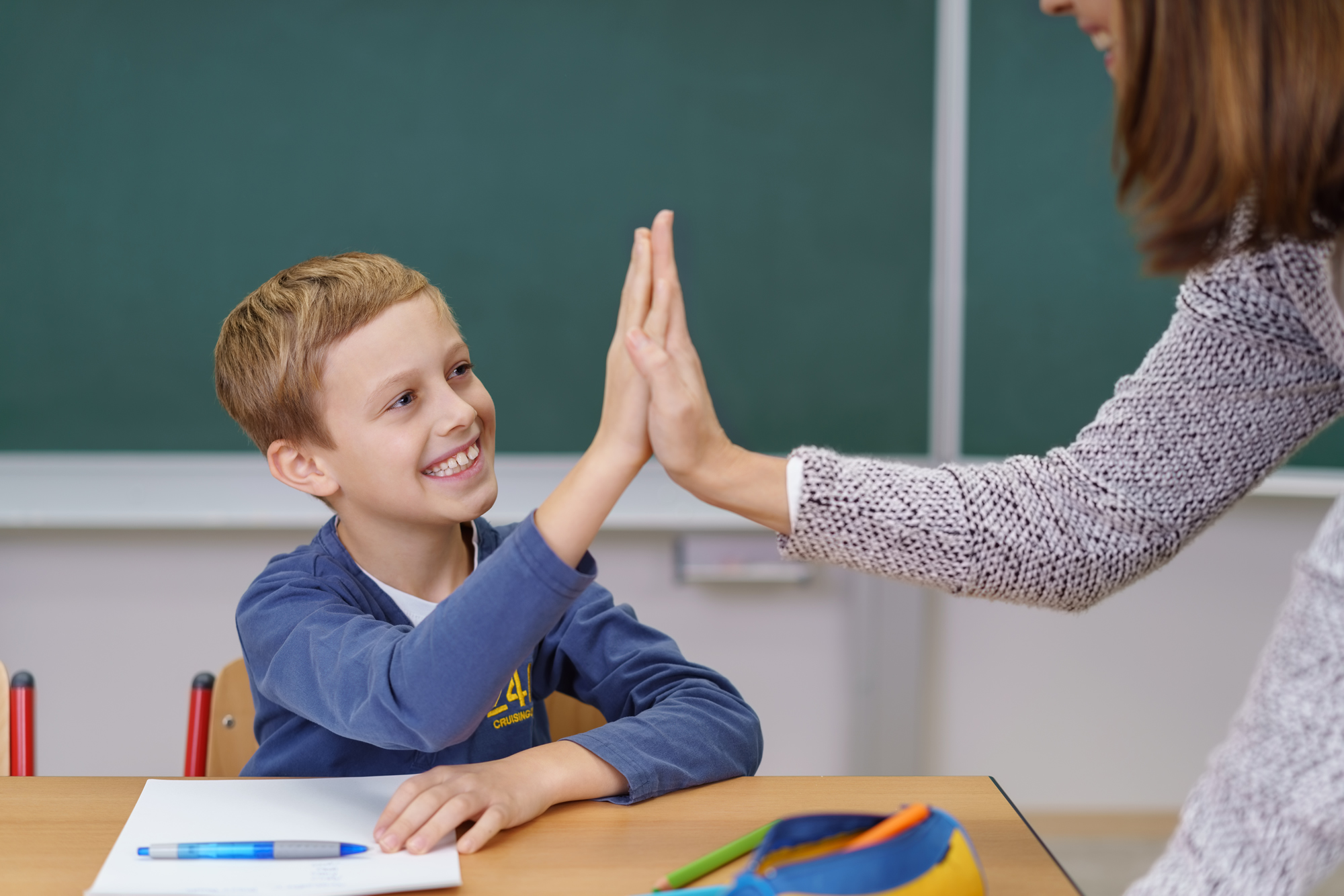 Teacher helps student
