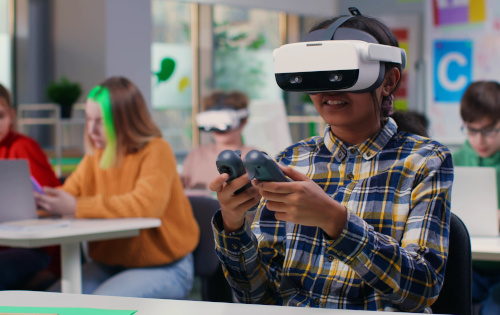 As new education trends lead to innovative teaching and learning, here are some of the top trends to look for, like this student wearing a VR headset in the classroom.